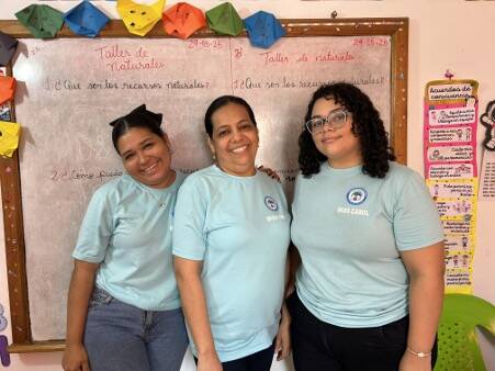 Miss Faidy (center) with two of her mentor teachers.